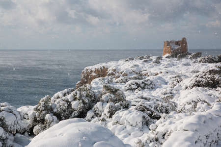 Uluzzo tower after a exceptional snowfall. 
Jan 2017, Salento, Italy.の写真素材
