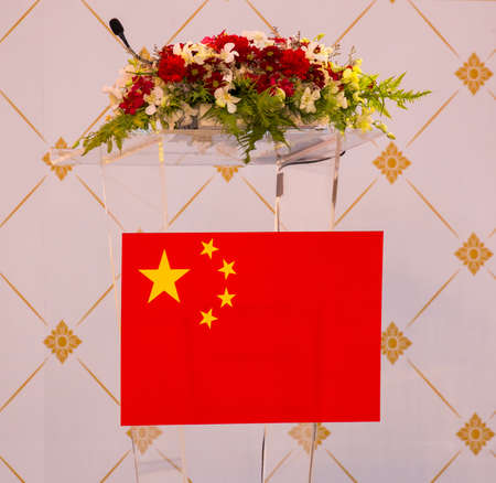 Lectern for conference with chinese flag and flowersのeditorial素材