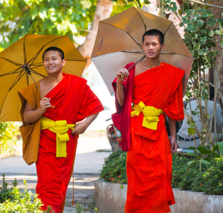 Novice monks with umbrella in Laoのeditorial素材