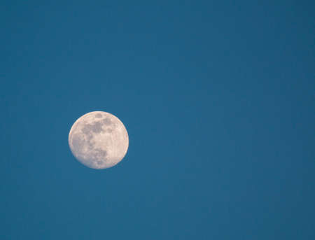 Full moon in the night blue skyの写真素材