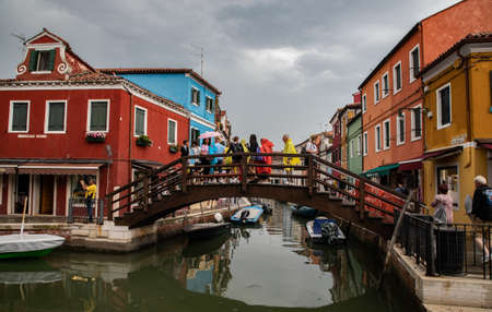colorful houses in Burano island near Venice in a cloudy day, Italyのeditorial素材