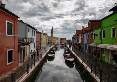 colorful houses in Burano island near Venice in a cloudy day, Italyのeditorial素材