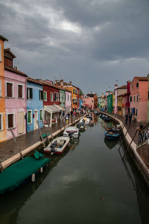 colorful houses in Burano island near Venice in a cloudy day, Italyのeditorial素材