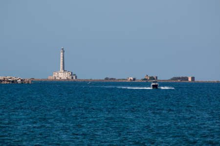 Lighthouse near ionian sea (St Andrea Island), Gallipoli, Salento, South Italyの写真素材