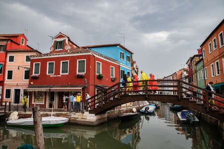 colorful houses in Burano island near Venice in a cloudy day, Italyのeditorial素材