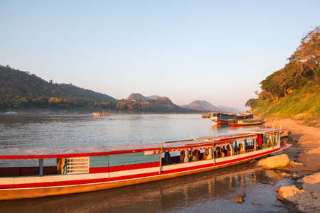 Fisherman boat on mekong riverの写真素材