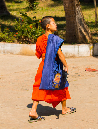Novice monk with colored tunicのeditorial素材