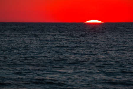Ionian sea , red sunset, Salento, Italyの写真素材