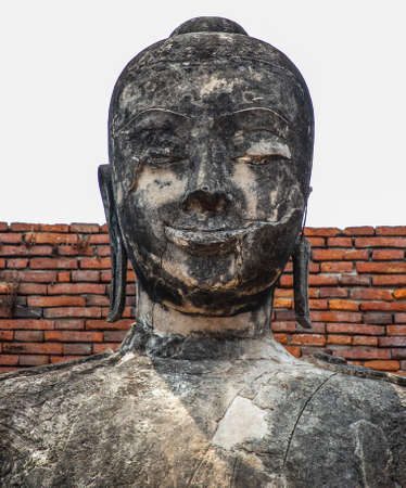 Buddha statue inside Wat Wora Chet Tha Ram, a Buddhist temple of archaeological park, Ayutthaya, Thailandの写真素材