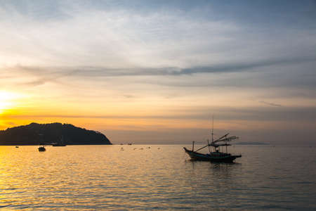 Fishermen boat at sunset near Koh Phangan island, Thailandの写真素材