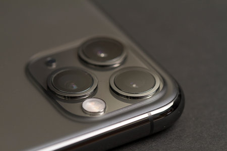 Milan, Italy - December 17, 2019: close up on a brand new iPhone 11 Pro on a black background.のeditorial素材