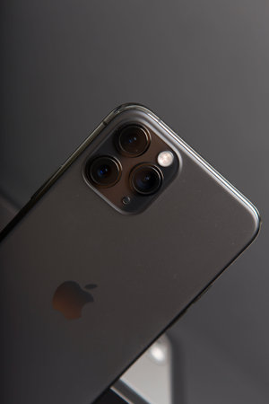 Milan, Italy - December 17, 2019: close up on a brand new Apple iPhone 11 Pro on a black background,...