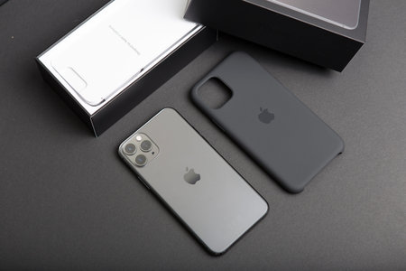 Milan, Italy - December 17, 2019: close up on a brand new Apple iPhone 11 Pro on a black background....