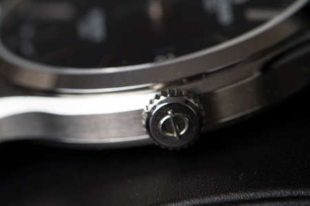 Milan, Italy - December 28, 2019: close up on a black Baume & Mercier man wristwatch, standing in its original package on black background.のeditorial素材