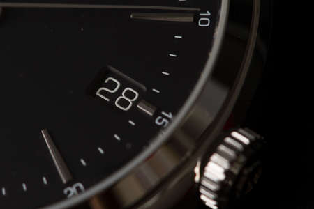 Milan, Italy - December 28, 2019: close up on a black Baume & Mercier man wristwatch, standing in its original package on black background.のeditorial素材