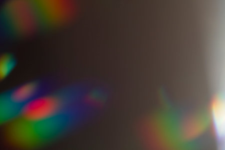 Lens flare and light leak haze texture on a black background.の写真素材