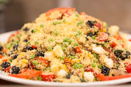 Fresh salad resting on a centeen shelf table top, no people are visible.の写真素材