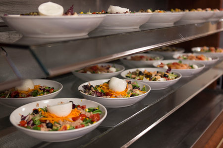 Close up on canteen food resting on a table top, no people are visible.