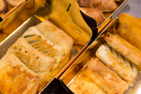 Close up on bakery products, resting on a table top, no people are visible.