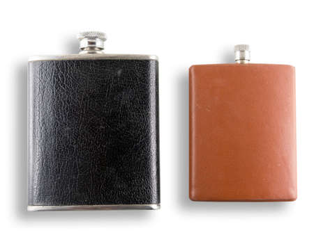 Close up on liquor flasks resting on white background with clipping path.の写真素材