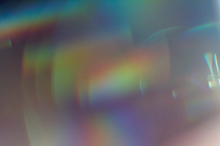 Colourful lens flare on black background.の写真素材