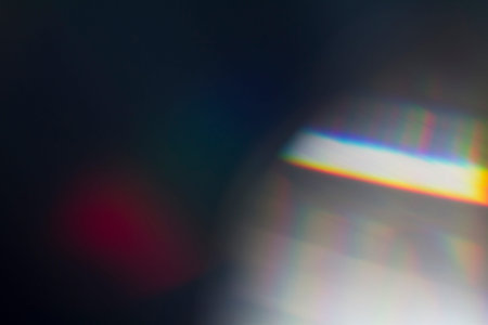 Sun reflection over a piece of crystal for a colorful lens flare on black background