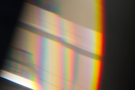 Sun reflection over a piece of crystal for a colorful lens flare on black background