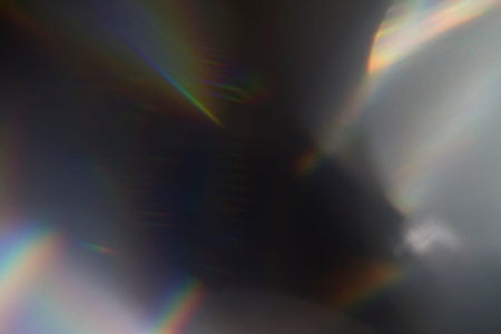 Sun reflection over a piece of crystal for a colorful lens flare on black background
