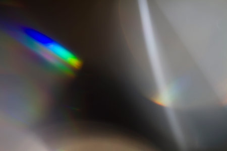 Sun reflection over a piece of crystal for a colorful lens flare on black background