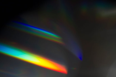 Sun reflection over a piece of crystal for a colorful lens flare on black background
