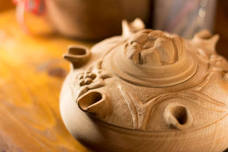 Close up on a wooden grole, a traditional italian cup handcrafted in wood and decorated with small lids.の写真素材