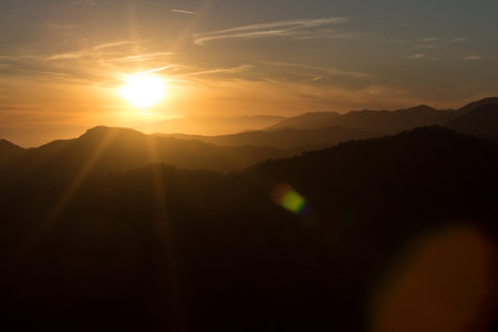 Epic sunset on the italian Alps facing the sea in Rapallo.の写真素材