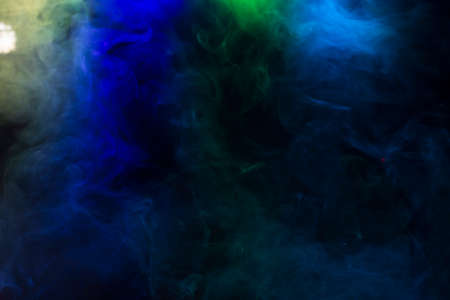 Colourful smoke pattern on black backgroundの写真素材