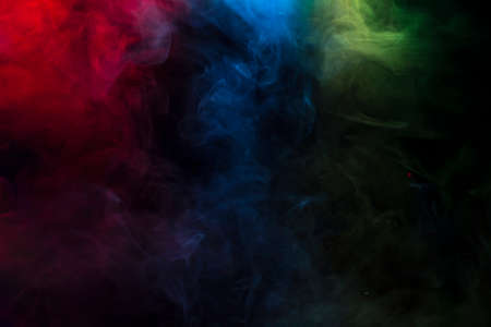 Colourful smoke pattern on black backgroundの写真素材