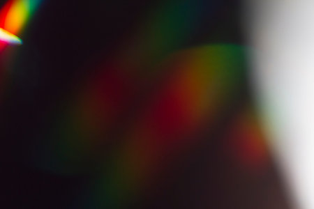Sunlight shining through a glass crystal, background is black for a perfect overlay effect.
