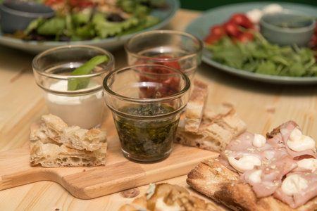 Close up on traditional happy hour appetizers from the italian tradition.