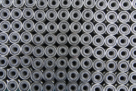 Close up on ball bearings lined up.