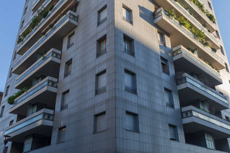Milan, Italy - June 21, 2020: looking up to a tall building in Milan, no people are visible, background is only sky.の写真素材