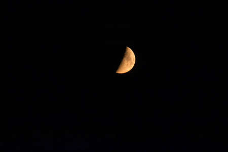 Night shot of a half giant red moonの写真素材