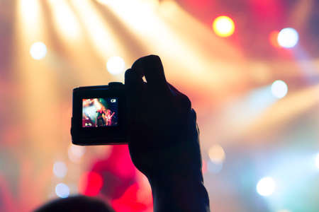 Concert photography with a smartphone during a music festivalの写真素材