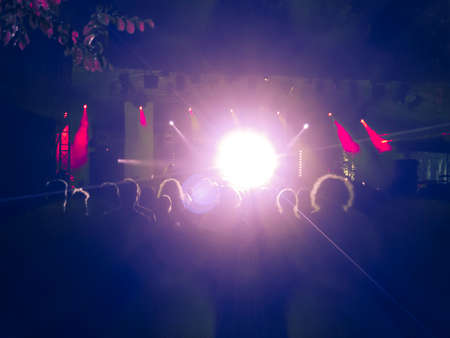 Close up on a welding machine in action, handheld by a worker wearing protective gloves.の写真素材