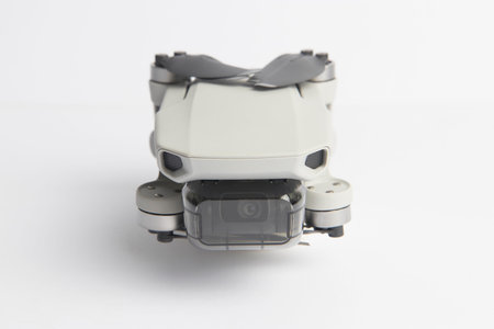 Milan, Italy - July 25, 2020: close up on a DJI Mavic Mini drone resting on a white background, no...