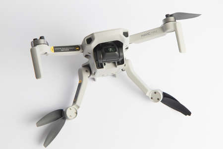 Milan, Italy - July 25, 2020: close up on a DJI Mavic Mini drone resting on a white background, no people are visible.のeditorial素材