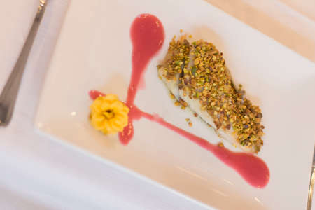 Close up on italian gourmet food resting on a restaurant table top. No people are visible.の写真素材