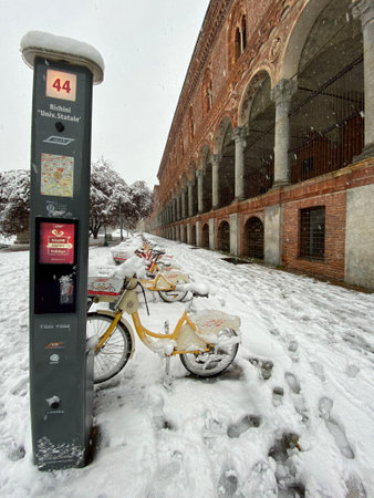 Milan, Italy - December 28, 2020: street view of Milan during the snow blizzard of late December, people are visible in the distance.のeditorial素材