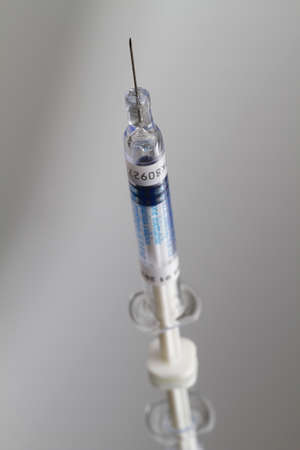 Close up on a small vaccine syringeの写真素材