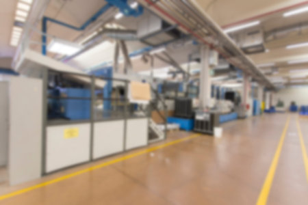 Blurred image showing the interior or a production facility, no people are visible.の写真素材