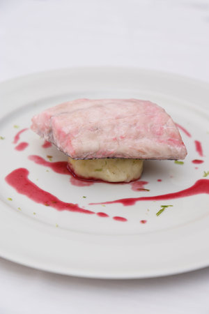 beef filet mignon with sauce on a white plate