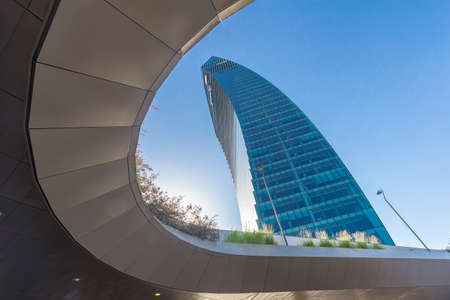 Milano, Italy - June 18, 2021: street view of Piazza Tre Torri in Milan during a summer daylight, buildings are visible against a clear blue sky.のeditorial素材