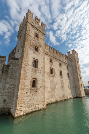 Sirmione, Italy - June 6, 2021: street view of Sirmione on Garda Lake, the castle is visible.